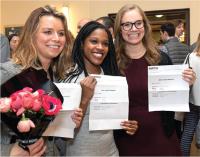 Happy medical students showing their match results.